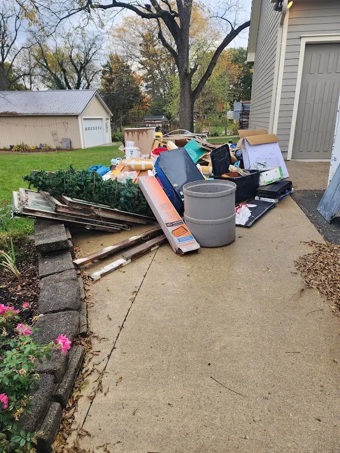 Dumpster being loaded with debris for Commercial Dumpster Rental in Eatonton